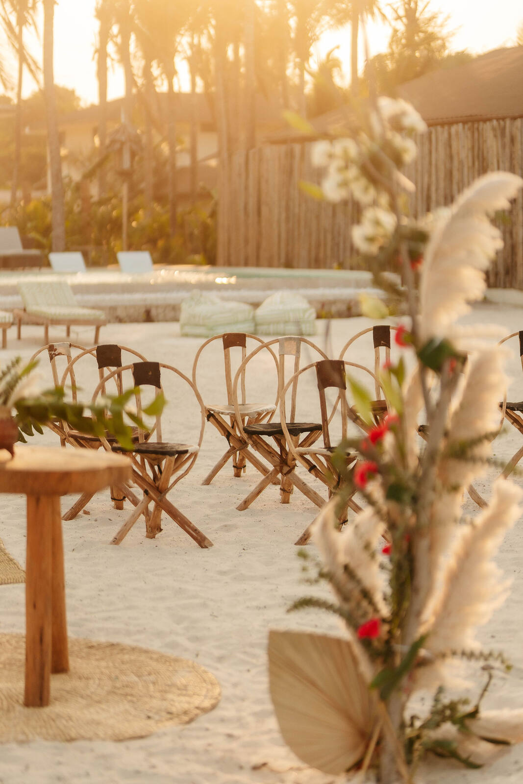 Beach ceremony seating at golden hour